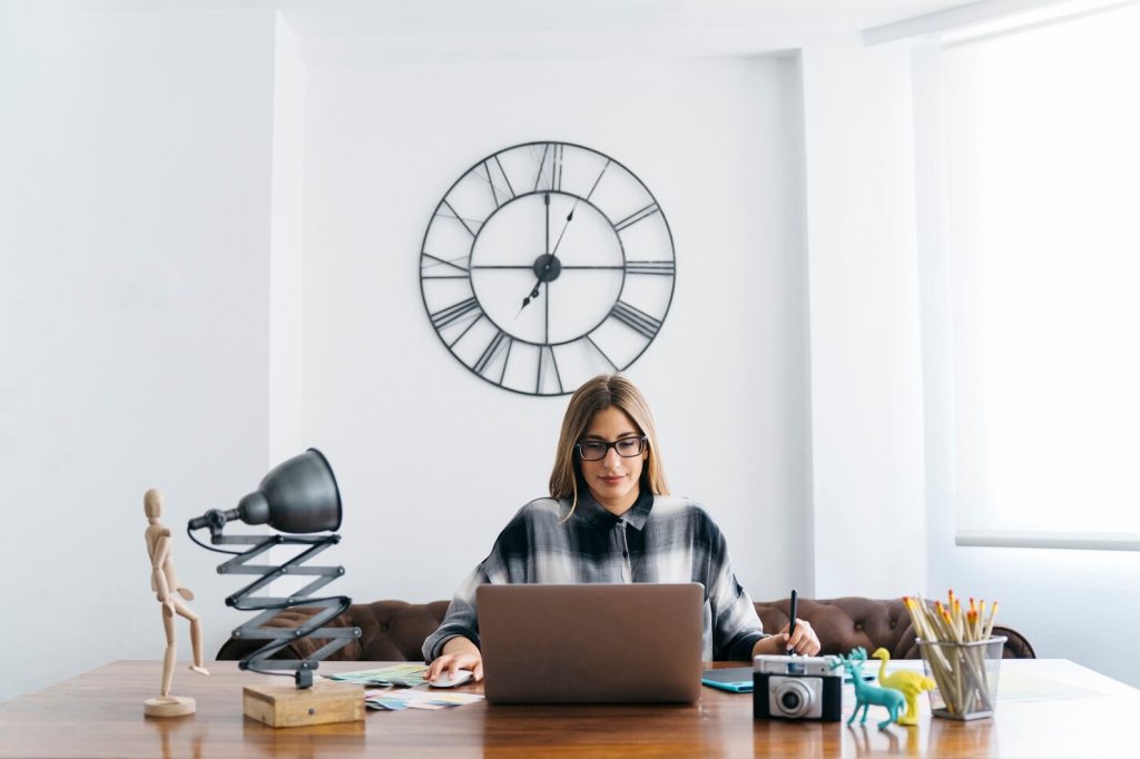 focused-woman-laptop-clean-workspace