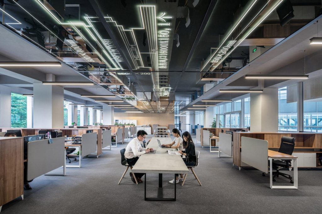 Open plan office interior with employees working