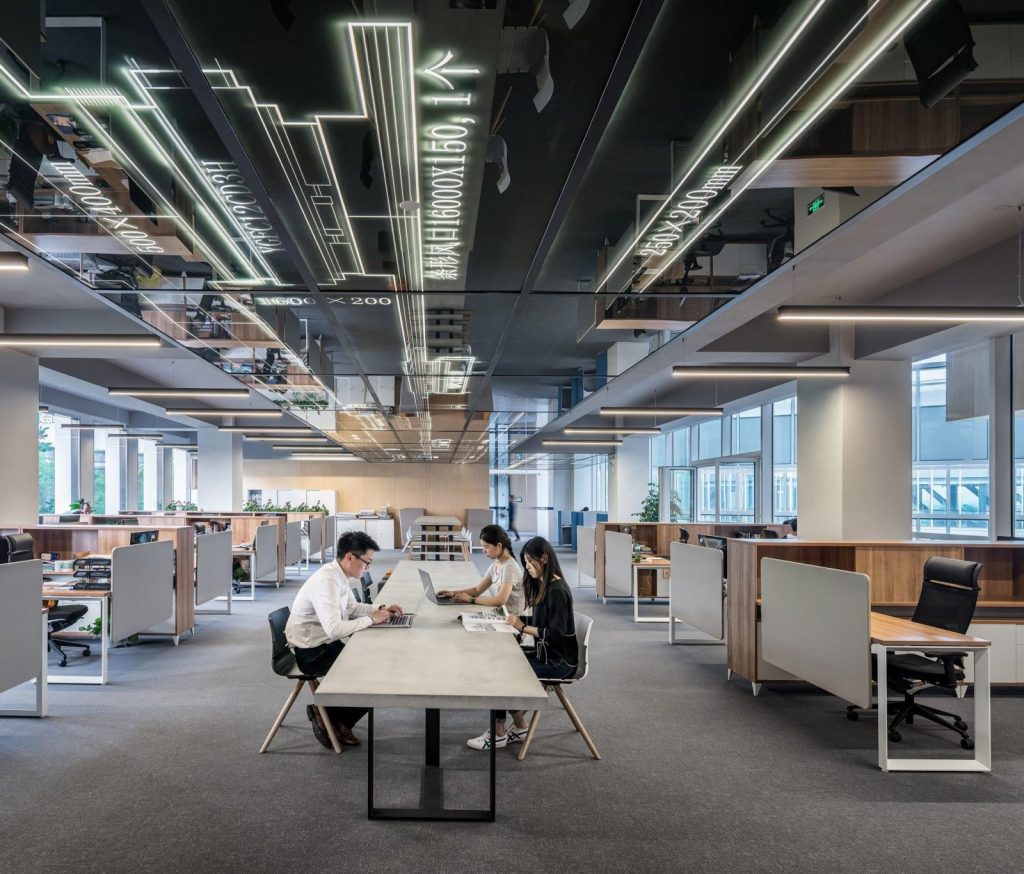 Open plan office interior with employees working