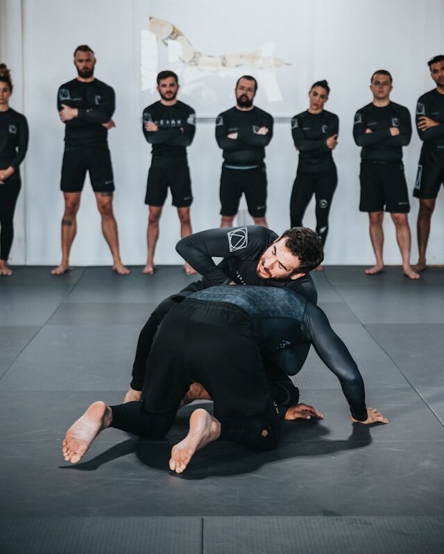 bjj-students-practising-on-mat
